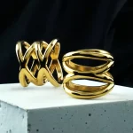 https://www.urbanbodyjewelry.com/products/gold-pvd-interlace-stainless-steel-ring?srsltid=AfmBOopv5JCy2r2bIHGCuEZSxm9vz8z3KxDta4i4FTy26OX0b9MdzNOz