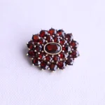Source : https://www.etsy.com/sg-en/listing/4480804808/no-tariff-vintage-bohemian-garnet-brooch?ls=s&ga_order=most_relevant&ga_search_type=all&ga_view_type=gallery&ga_search_query=tombac+jewelry&ref=sr_gallery-1-18&frs=1&sts=1&content_source=79bf462d-cc02-4fe6-9504-da6a7466e688%253ALT61bd722c02597ed8055c9f506af8f35954658f7d&organic_search_click=1&logging_key=79bf462d-cc02-4fe6-9504-da6a7466e688%3ALT61bd722c02597ed8055c9f506af8f35954658f7d